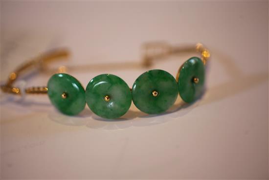 A Chinese high carat gold and jadeite bracelet, gross weight 15.5 grams.